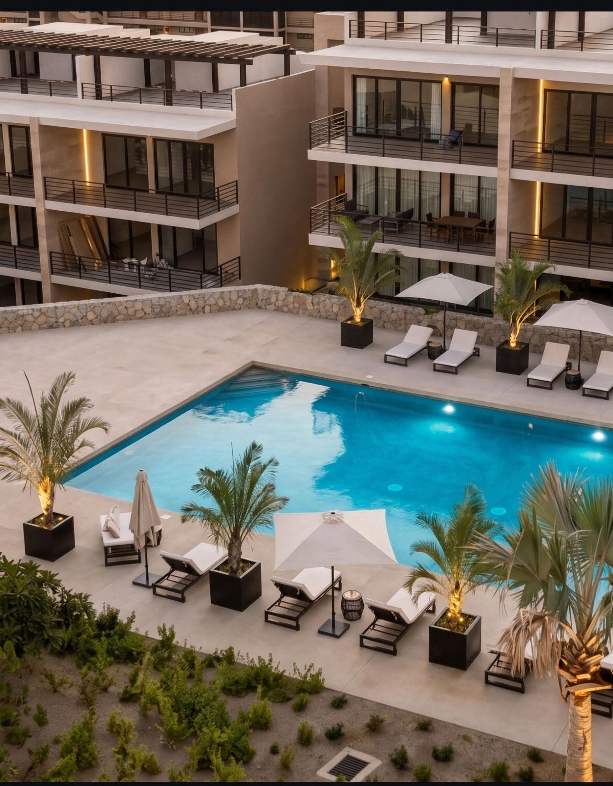 Residencial Tramonti Paradiso pool deck and amenities courtyard at dusk